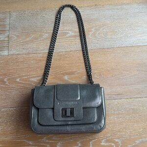 BCBGMAXAZRIA leather crossbody bag with a chain strap
